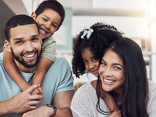 Image showing Parents, kids and happy family home portrait in living room, lounge and relaxing quality time, play and fun together in Spain. Smile mom, dad and bonding with young children in love, support and care