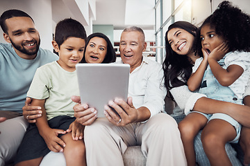 Image showing Family, home and fun people with tablet streaming a movie, subscription video or show online. Love, surprise and happy big family on a sofa smile while bonding, relax and enjoy quality time together