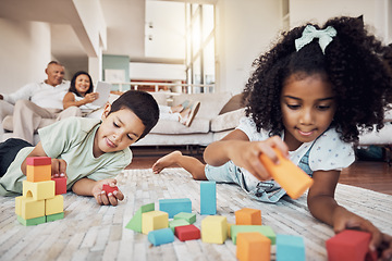 Image showing Kids, building blocks and creative learning in family home, living room floor and ground for growth, development and fun. Focus children, educational brick toys and youth creativity in lounge house