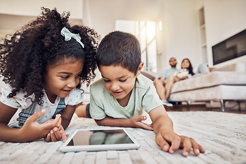 Image showing Streaming video, internet tablet and children watching cartoon on technology on the living room floor. Sibling kids learning on the internet with tech and relax with movie online together in house