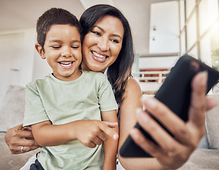 Image showing Happy mother and child with smartphone on sofa for games app, funny social media post or elearning website. Kid with mom on couch and cellphone education, video call or watch comedy video online