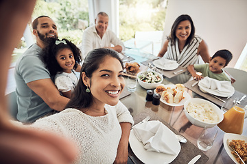 Image showing Big family selfie while eating food or lunch together in their home dining room table with a portrait smile. Happy Puerto Rico parents, mother and father with children for digital holiday memory