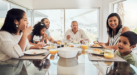 Image showing Happy, food and big family morning breakfast at dining table in home talking, eating and bonding. Grandparents, parents and children relaxing while enjoying meal together with happiness, love and fun