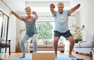 Image showing Elderly, couple and yoga in home with laptop for training with video online. Man, woman and retirement with computer for class on internet together in living room for health, wellness and fitness