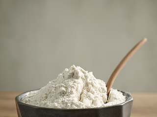 Image showing bowl of flour and wooden spoon