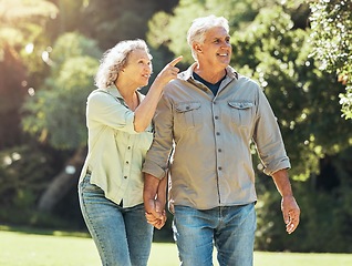 Image showing Senior couple, outdoor and conversation in nature park and active on hiking adventure or walk for love, relax and fresh air. Happy old man and woman outside in a healthy relationship in retirement