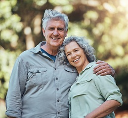 Image showing Senior couple, love and hug in nature together for support, care and smile in outdoor park. Portrait of joy, happiness and elderly man and woman happy in retirement, romance and quality time outside