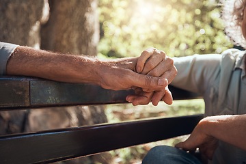 Image showing Support, love and helping hand holding of elderly people showing solidarity and community in a park. Senior man and woman hands together in retirement on a park bench outdoor with hope and trust