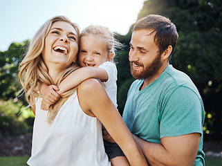 Image showing Family, child and outdoor fun in nature with girl, mother and father at park playing and laughing on an adventure. Girl kid or daughter of happy man and woman parents outdoor to play piggy back game