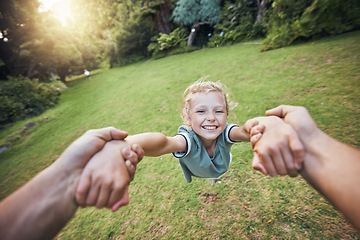Image showing Child spinning from hands in park, pov and happy summer evening. Fun time, motion and girl in garden swinging from arms, support from dad in nature. Kids, grass and swing from hand in field in Sweden