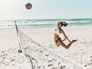 Image showing Black woman, beach and volleyball for fitness, health and exercise on vacation in summer. Girl, sports or ocean play with ball on sand to workout for wellness in sunshine on holiday in Cancun, Mexico