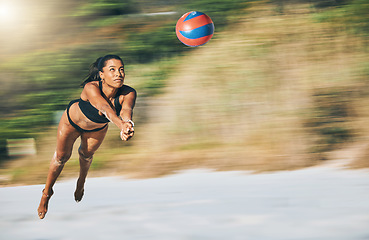 Image showing Fitness, beach and volleyball with woman diving on Brazil holiday for summer, sports and workout. Exercise, health and training with girl in bikini for games, competition and wellness vacation