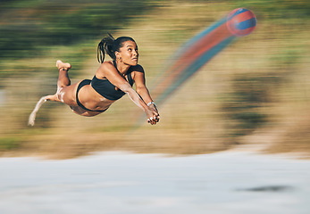 Image showing Volleyball, beach sports and fast woman in bikini while on holiday travel in Miami during summer. Jump, cardio and strong girl playing in sport competition by the ocean on vacation for fitness