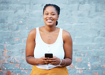 Image showing Smartphone, social media and black woman with networking, internet connection or online search on blue wall mockup. Happy african girl with cellphone and portrait for website app marketing mock up