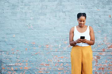 Image showing Black woman, fashion and phone by mock up wall in Nigerian city for marketing, advertising or sales deal promotion mockup. Smile, happy or trend student with mobile technology for social media search