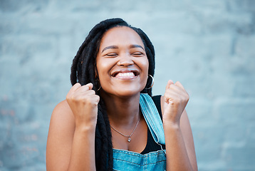 Image showing Black woman, happy and excited smile of a winner from Jamaica feeling happiness. Smiling face of a person with excitement, positive energy and gratitude mindset with a gray brick background