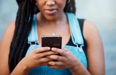 Image showing Black woman hands with smartphone for social media, website contact information or reading online blog newsletter in youth urban lifestyle. Teenager with cellphone typing on chat app or 5g networking