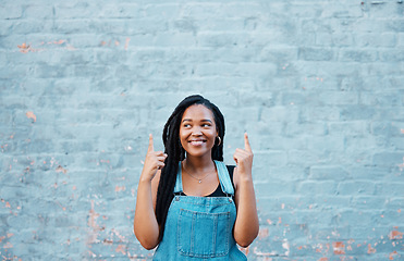 Image showing Black woman fingers pointing to advertising mockup or marketing space on blue wall outdoor youth lifestyle. Happy gen z or african teenager hands showing blank information sign for a sale mock up