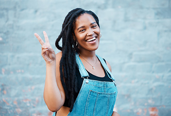 Image showing Black woman, peace sign or fashion on city building wall, mockup space or mock up in style, trend or cool clothes in Atlanta. Portrait, happy smile or student model with fun, cool or playful gesture