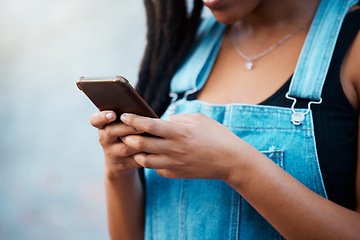 Image showing Gen z black woman hands, social media and city phone typing, contact and communication on smartphone internet technology in Jamaica city. Closeup urban girl mobile apps, connect to 5g website online