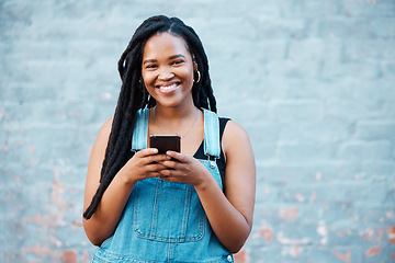 Image showing Happy black woman, portrait smile and phone in communication, texting and social media outdoors. African female smiling for 5g connection in Canada on mobile smartphone messaging in happiness outside