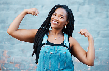 Image showing Happy black woman, portrait smile and muscle power, strength and confident pose on wall background. Proud African female flexing biceps, muscles and smiling for women empowerment in South Africa