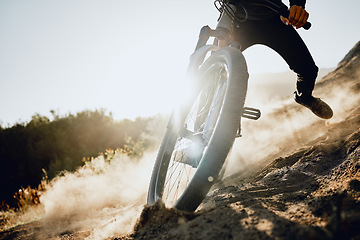 Image showing Action, mountain bike and man training in dirt, dust for sports, adventure or outdoor marathon travel with blue sky mockup advertising. Risk, danger and motorcycle person with challenge speed closeup