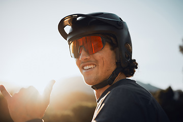 Image showing Mountain bike, nature and man cycling for fitness training in the mountains of Peru during summer. Portrait of a sports person with glasses during adventure in the countryside and hands sign