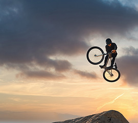 Image showing Mountain bike, jump and sport with mockup of a man athlete with energy and speed in nature. Healthy sports person with speed jumping and cycling with his bicycle at sunset on mountains with mock up