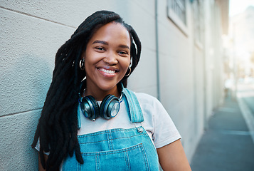 Image showing Black woman, smile and happy urban student girl on city street smiling and leaning against a wall outside on commute to college. Portrait of an African gen z female outdoors traveling in South Africa