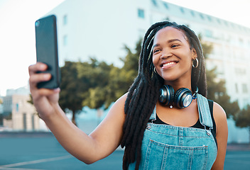 Image showing Happy young black woman in city, selfie video call on smartphone and New York wifi 5g connection. Digital technology, african girl smile on street and online mobile ux in cool urban lifestyle