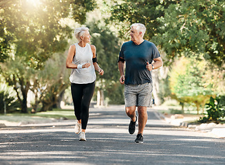 Image showing Health, senior couple and running while talk and exercise for fitness, wellness and healthy together in nature. Retirement, man and woman enjoy workout, chatting and jog outside in park on sunny day