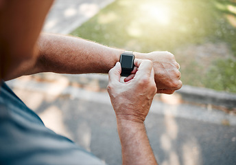 Image showing Man, street and running with smartwatch for heart reading, health and fitness on break. Runner, watch and road check time, speed or distance on workout, exercise or training outside for body wellness