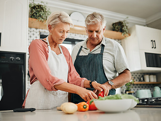 Image showing Elderly, couple and kitchen for cooking with vegetables for dinner with nutrition food. Man, woman and in retirement learning to cook for healthy diet in home together, love and vegan meal in house