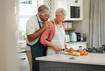 Image showing Senior couple, bonding and cooking in kitchen in a house or home for marriage anniversary or celebration lunch. Smile, happy and love retirement elderly man and woman with nutrition health food