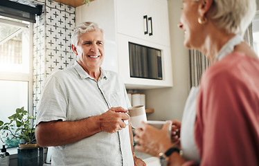 Image showing Senior man, drinking coffee and conversation with woman in kitchen at home in New Zealand. Happy, elderly and smile couple enjoy morning tea, chat and relax together in apartment for retirement break
