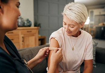 Image showing Covid vaccine, plaster and doctor with patient in a health consultation at a retirement house. Nurse, healthcare worker and elderly woman with a bandaid on her arm after a treatment in a nursing home