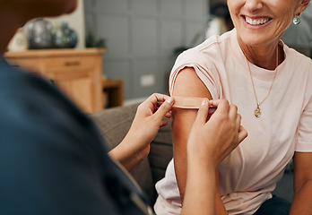 Image showing Woman, smile and plaster after injection for vaccine against covid. Happy, senior and lady vaccination for coronavirus on sofa in doctor office for health, wellness and safety from global pandemic