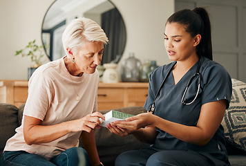 Image showing Home, healthcare and doctor help elderly patient in assisted living care facility, explain medicine on a sofa. Support, pills and senior care checkup with nurse discuss option and recovery treatment