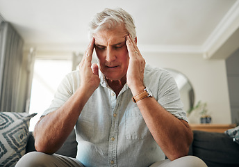 Image showing Senior man with headache, stress or anxiety about retirement, financial problem or house mortgage in his living room. Sick elderly man with migraine pain or mental health risk and frustrated on sofa