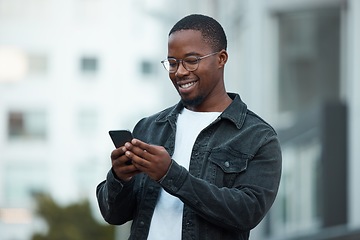 Image showing Black man, phone and smile in city reading email, social media or blog on internet. Man, glasses and smartphone outside in Chicago happy with communication on mobile app via 5G web while outdoors