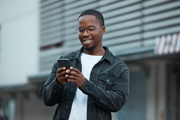 Image showing Black man, phone and social media in city reading text message or communication on social network app. African American person, chat conversation and happy on 5g mobile smartphone in Atlanta smile