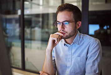 Image showing Accountant man, night and thinking at computer in office for strategy plan with business expenses. Expert corporate finance employee in workplace late with focus and concentration to finish work.