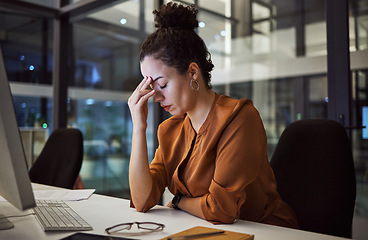 Image showing Woman working at night with headache, burnout and stress over social media marketing project or company deadline. Anxiety, exhausted and tired web or online business advertising expert with migraine