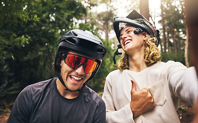 Image showing Friends, cycling men and selfie in forest, park or woods cyclist trail in nature. Thumbs up, fitness and cyclists, bikers or bike rider smile in mountain biking helmets in park outdoor bicycle ride.