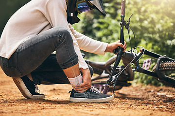 Image showing Man, ankle pain and abstract injury in dirtbike sports for wellness exercise, training and health workout in Norway forest. Fitness stress, burnout and medical emergency or leg accident for cyclist