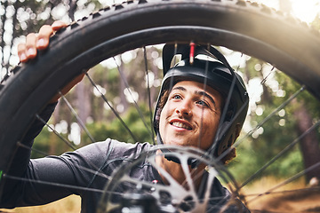 Image showing Bicycle, cycling and man check tire quality, pressure or stability for nature travel, exercise or fitness training. Mountain bike sports person checking wheel for health workout in Canada forest park