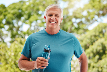 Image showing Fitness, garden and a senior man with water bottle, exercise and hydrate in retirement. Health, nature and workout, a happy elderly guy from Canada with smile standing in outdoor park on a summer day