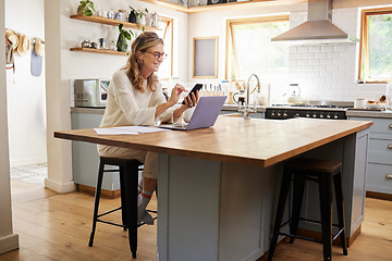 Image showing Woman, phone and kitchen smile for social media, email or text while work online. Mature, lady and smartphone with laptop for communication in remote job on web, laughing at meme or joke on cellphone