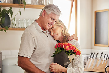 Image showing Flower bouquet, hug and senior couple in celebration of love, marriage and anniversary in their house. Happy elderly man and woman hugging with rose flowers for gift or present for birthday in home